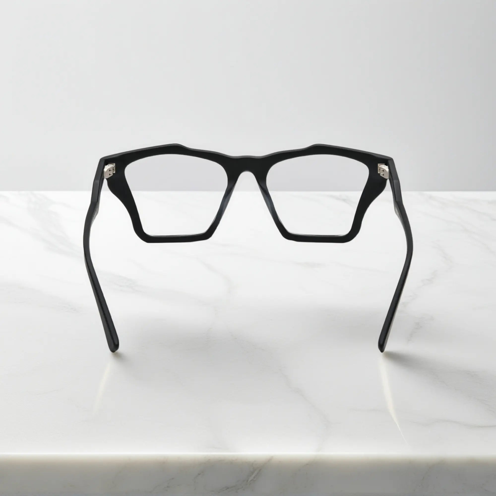 Rear view of VoyueLens? Charcoal Black frame, displaying solid matte black with subtle gray temples from the inner frame and hinge area.